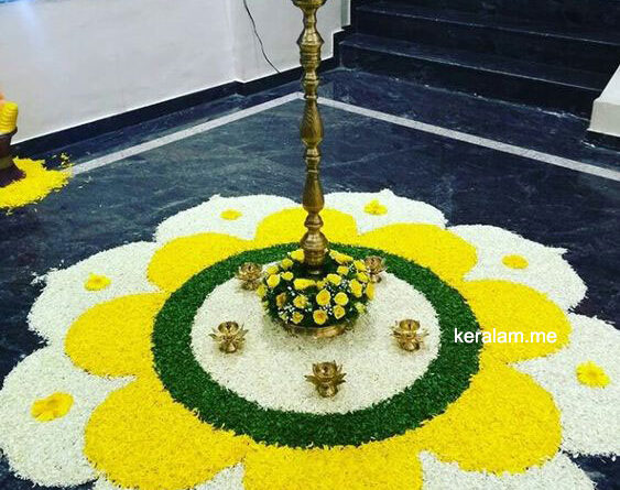 onam pookalam 2021 with white and yellow flower
